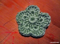 a photo of a green crocheted flower